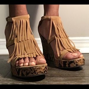 Tan fringed sandals with snake skin inspired wedge